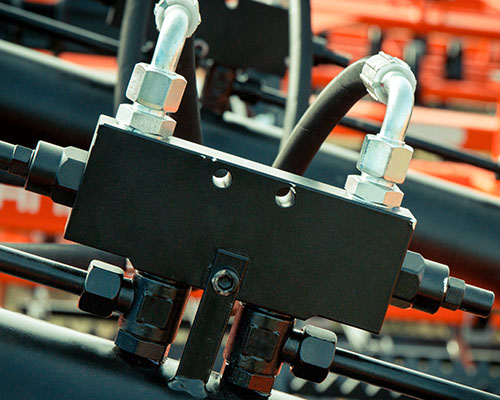 Detail and part of hydraulic or pneumatic mechanism in industrial or agricultural machine. Technology and engineering